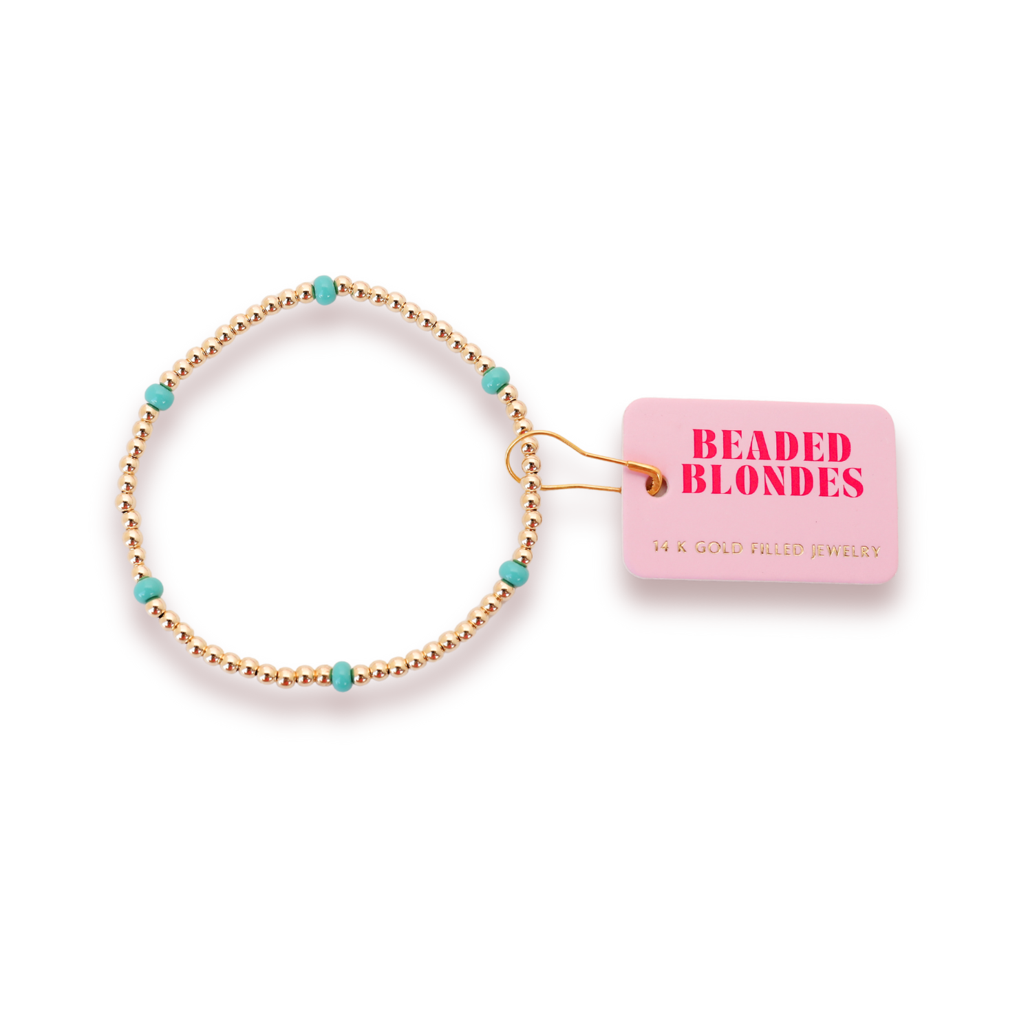 Beaded Blondes 14K gold filled beaded bracelet with alternating golden and turquoise beads displayed alongside its pink "Beaded Blondes" brand tag attached by a gold safety pin