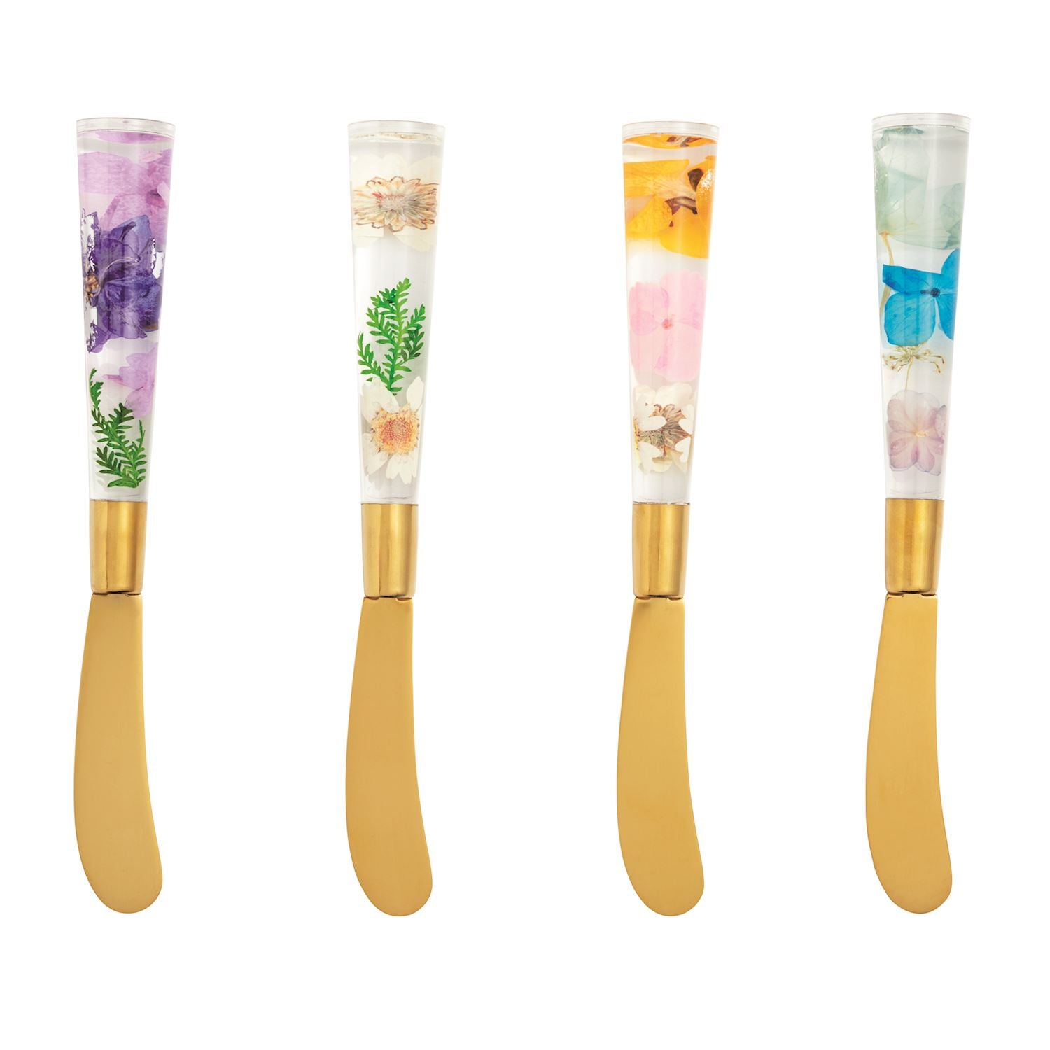 Four gold butter knives with clear resin handles containing pressed flowers