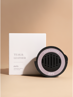 Black car fragrance diffuser with a pink ring beside its box
