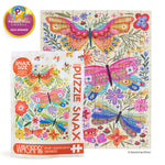 Illustrated jigsaw puzzle by Kenzie Kae Elston featuring vibrant patterned butterflies and floral motifs on a cream background, shown with its Puzzle Snax packaging and a gold 2024 Parents' Picks Awards winner seal