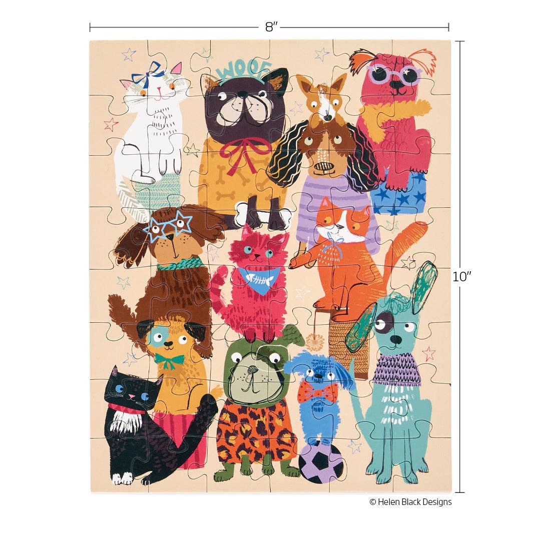 Jigsaw puzzle by Helen Black Designs featuring a vibrant collection of cartoon dogs and cats including a black bulldog in an orange WOOF shirt, a brown dog with star glasses, and a pink cat with a fishbone bandana