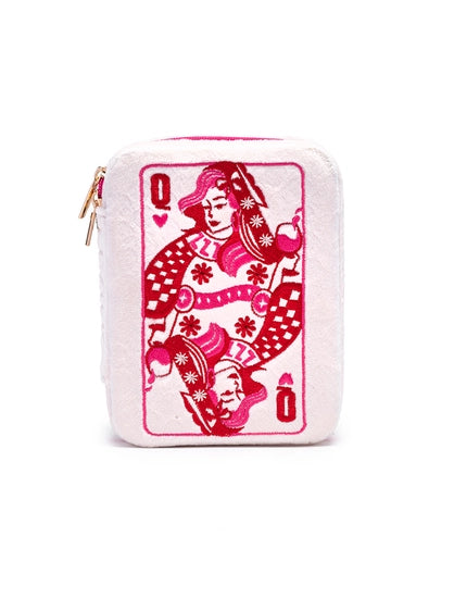 White plush clutch bag embroidered with a vibrant pink and red Queen of Hearts playing card design holding a goblet and adorned with stylized hearts and stars featuring a golden zipper