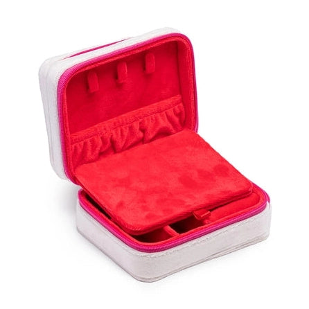 Open white travel jewelry case with bright red velvet interior and necklace hooks