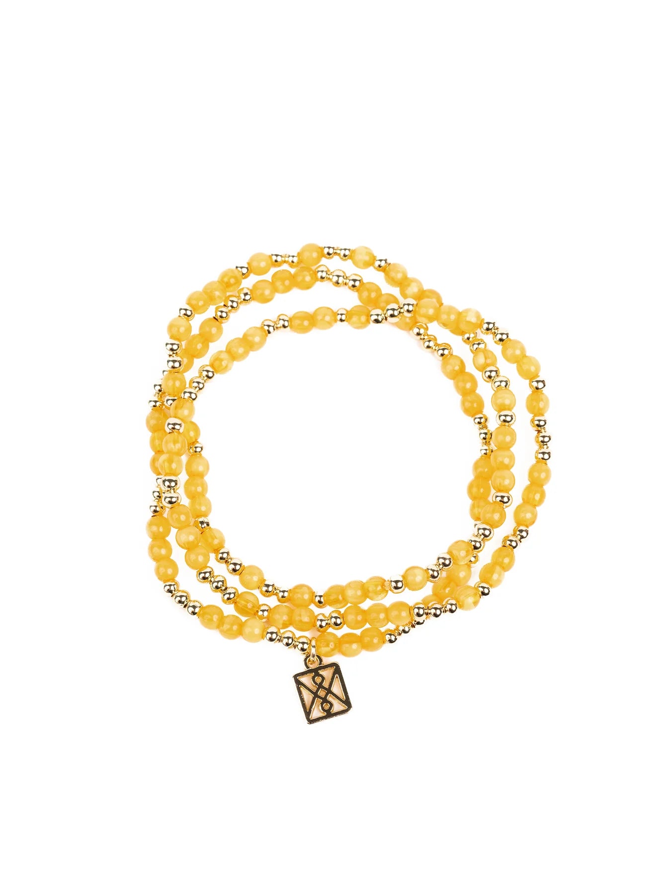 Jewelry multi-strand bracelet featuring polished honey-yellow gemstone beads interspersed with small gold accent beads and a square gold charm detailed with an intricate black geometric symbol