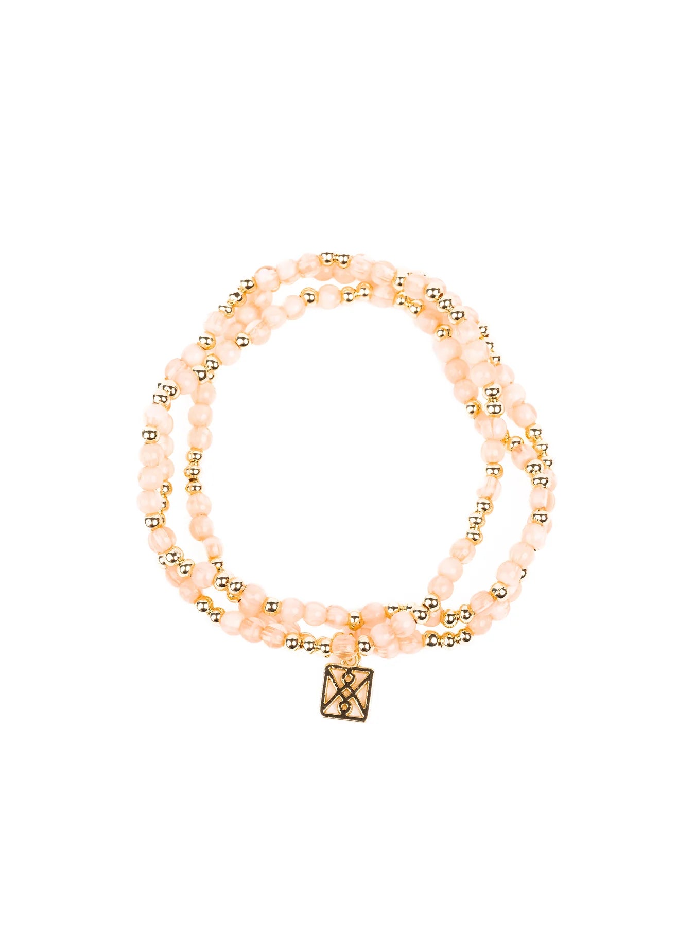 Photograph of a multi-strand bracelet featuring pale pink faceted beads, small gold spacer beads, and a unique square gold charm with a geometric pattern on a white background