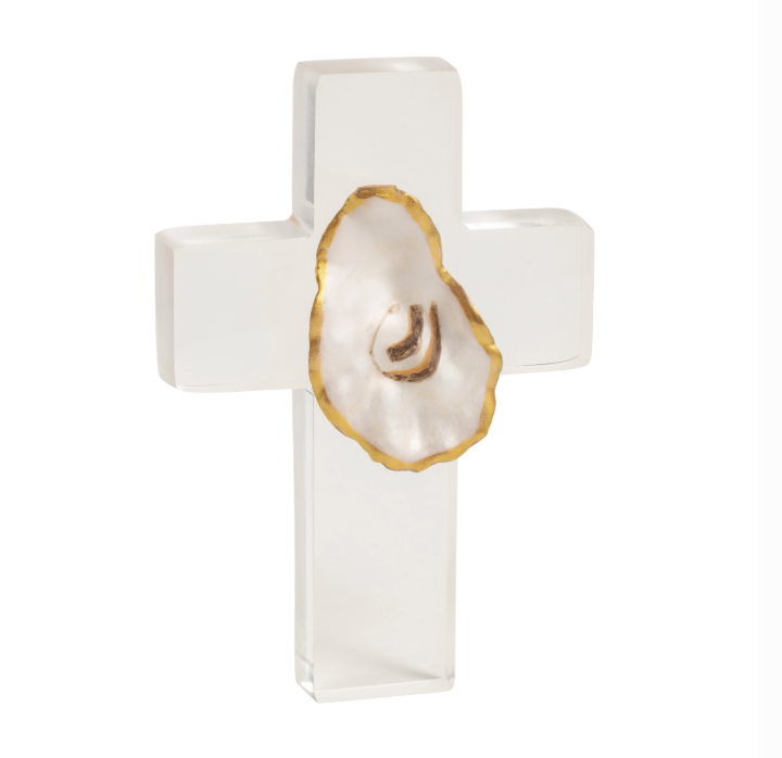 Acrylic and oyster shell sculpture by Grit & Grace Studio of a standing cross on a white background featuring a gold-gilded oyster shell with a pearlescent interior and polished translucent lucite arms