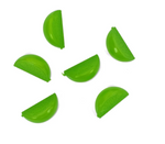 Five plastic lime wedges arranged on a white background