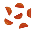 Five plastic orange slices arranged on a white background
