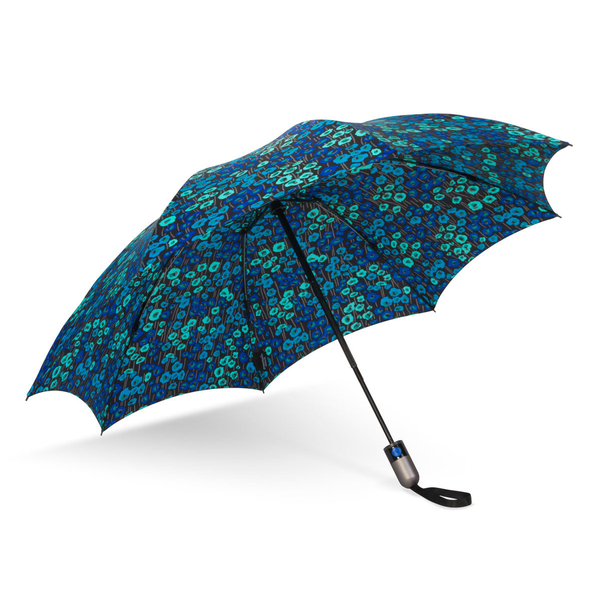 An open umbrella with a vibrant blue and teal floral pattern on a black background featuring a sleek silver handle with a black wrist strap