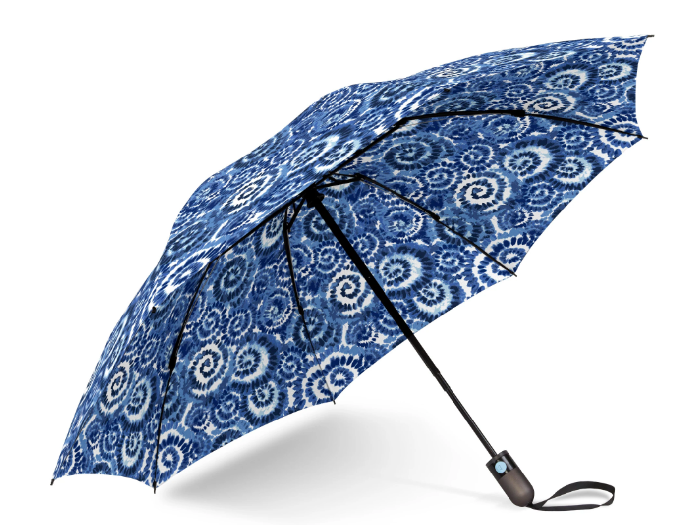 An open umbrella with a vibrant blue and white tie-dye spiral pattern and a black handle featuring an automatic button and wrist strap