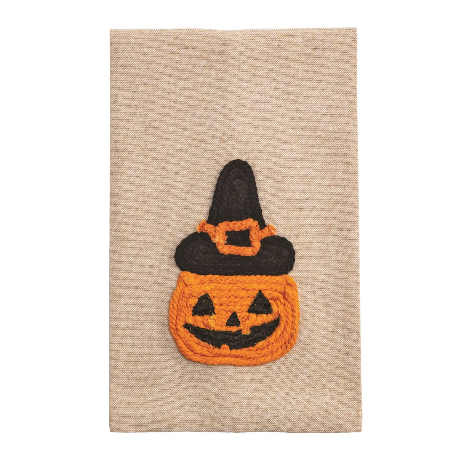 Yarn appliqué artwork featuring a smiling orange jack-o'-lantern pumpkin with black facial features wearing a black witch's hat adorned with an orange buckle, all crafted with textured rope-like yarn on a neutral beige linen fabric