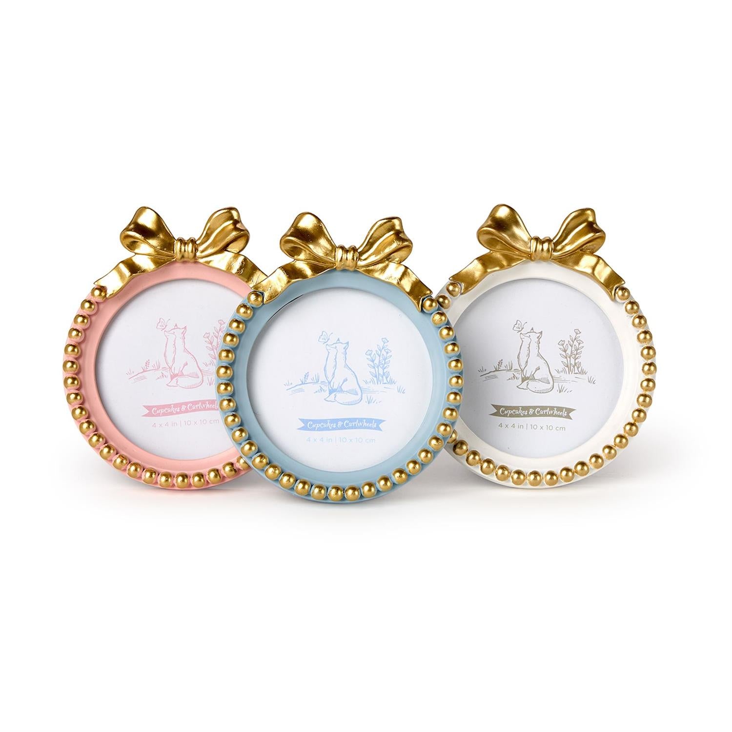 Resin picture frames by Cupcakes & Cartwheels featuring three round decorative frames in pink blue and white featuring metallic gold bows and gold beaded trim with fox illustrations