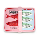 A ceramic serving dish shaped like a colorful sardine tin featuring stylized red and green fish on pink and light blue panels with text SARDINES IN OLIVE OIL and a pink pull-tab handle