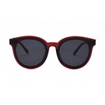 Product photography I-SEA sunglasses with dark red round frames, dark gray lenses, and the I-SEA logo on the right temple on a white studio background