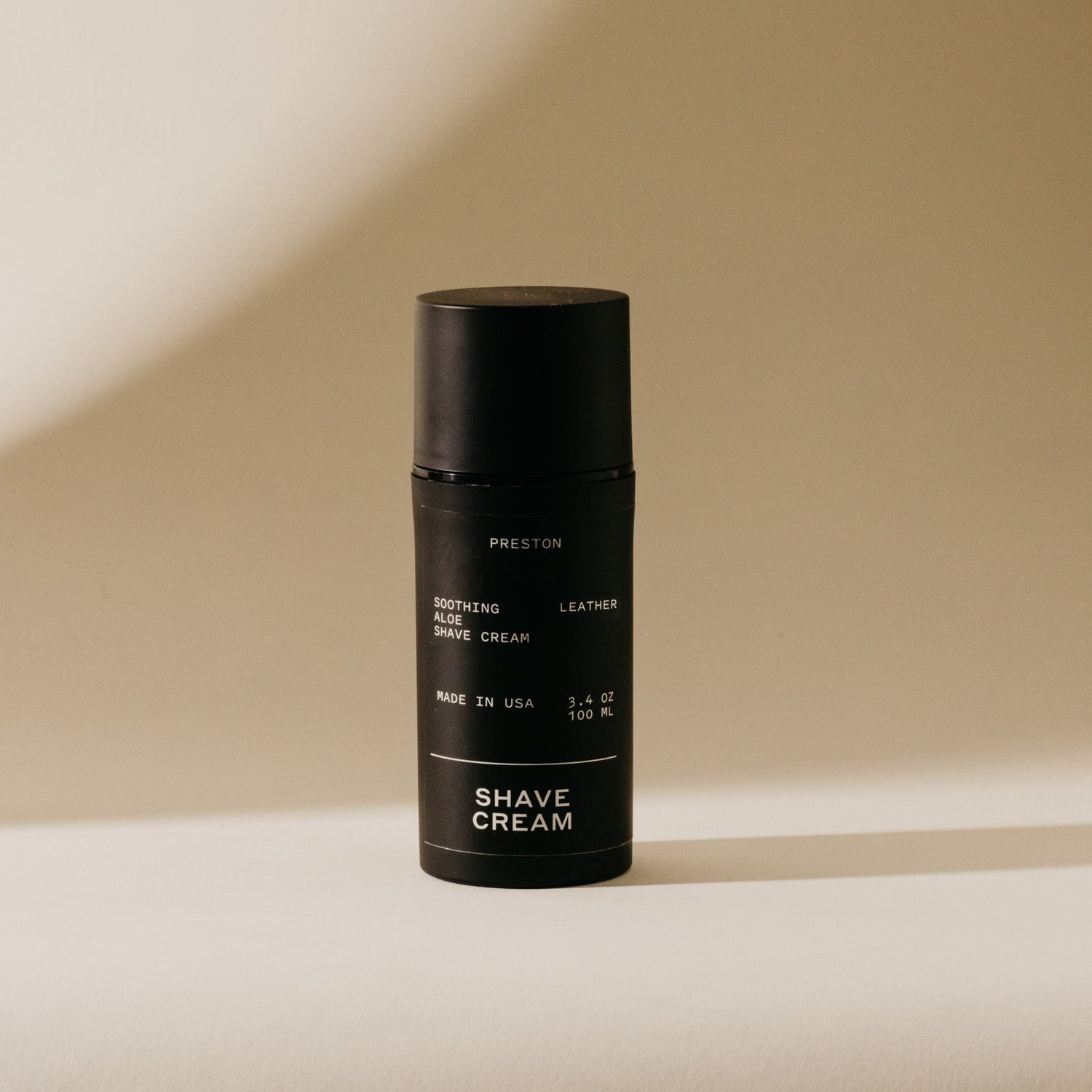 Black bottle of Preston soothing aloe leather shave cream