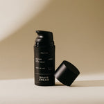 Black pump bottle of Preston soothing aloe shave cream with cap removed