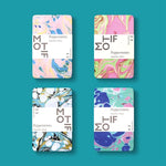 Four Motif Peppermints Sugarfree Mints packages displayed in a grid on a teal background, each with a unique abstract marbling design featuring vibrant pastel colors like pink, blue, green, black, and white, showcasing Sherbet Dizz, Fuzz, and Fizz varieties