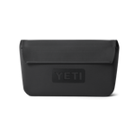 Product photograph by YETI of a black rectangular dry pouch with a top flap closure and a debossed YETI logo on a black studio background