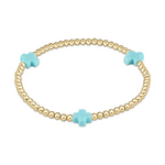Gold beaded jewelry bracelet with three light blue cross charms