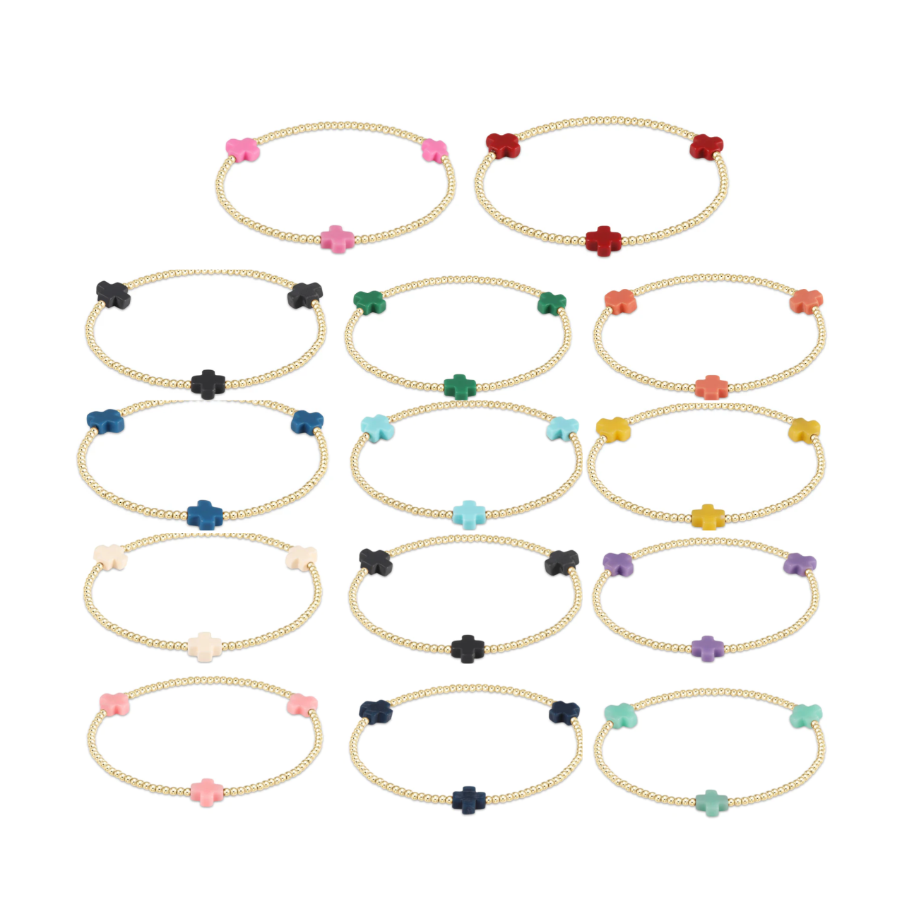 Digital photograph of a collection of gold beaded stretch bracelets featuring vibrant clover charms in shades of pink, red, blue, and green on a white studio background