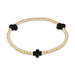 A gold beaded stretch bracelet featuring three polished black cross-shaped charms
