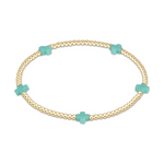 Gold beaded stretch bracelet with four turquoise cross charms