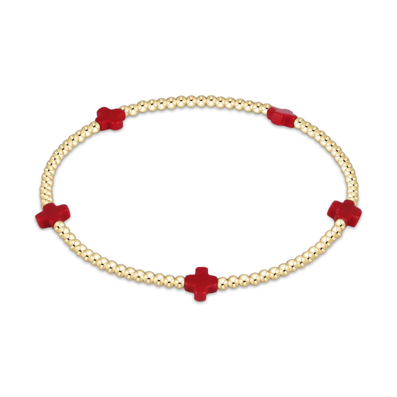 Gold beaded stretch bracelet with red cross shaped accents