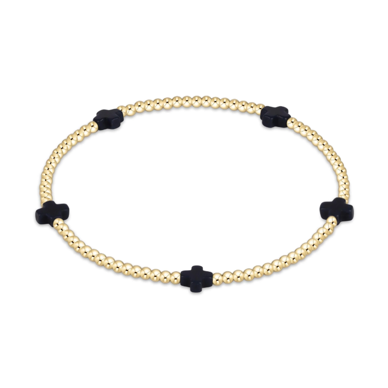Gold beaded stretch bracelet with four black cross shaped beads