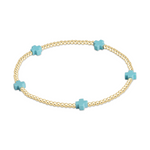 Gold bead bracelet with four light blue cross shaped beads