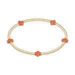Gold beaded stretch bracelet with four orange cross charms