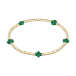 Gold beaded stretch bracelet with five green cross charms