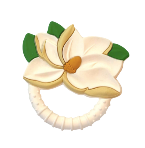 Silicone baby teether featuring a white magnolia flower design with green leaves, an orange center, and a textured teething ring