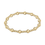 Gold bracelet featuring an elegant pattern of polished spherical beads in alternating sizes