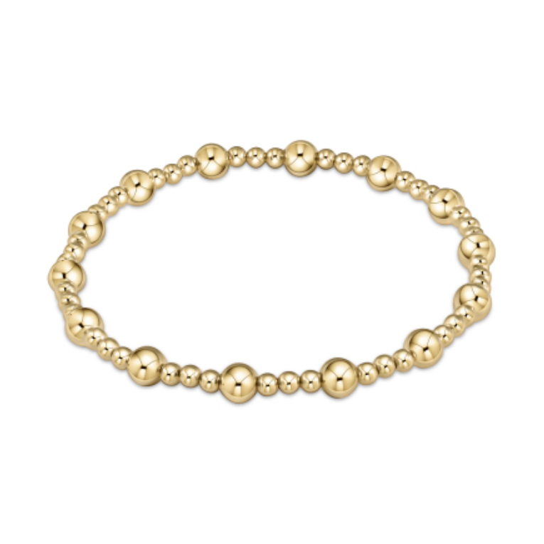 Gold bracelet featuring an elegant pattern of polished spherical beads in alternating sizes