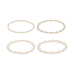Four stretch bracelets with varying sizes of gold beads and white pearls