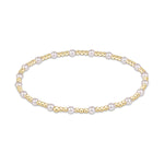 Stretch bracelet with alternating gold beads and white pearls