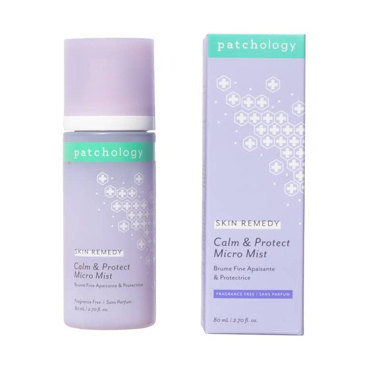 Patchology Skin Remedy Calm & Protect Micro Mist in a lavender spray bottle and matching rectangular box featuring a teal logo, a distinctive pattern of repeating white crosses, and "Fragrance Free" text