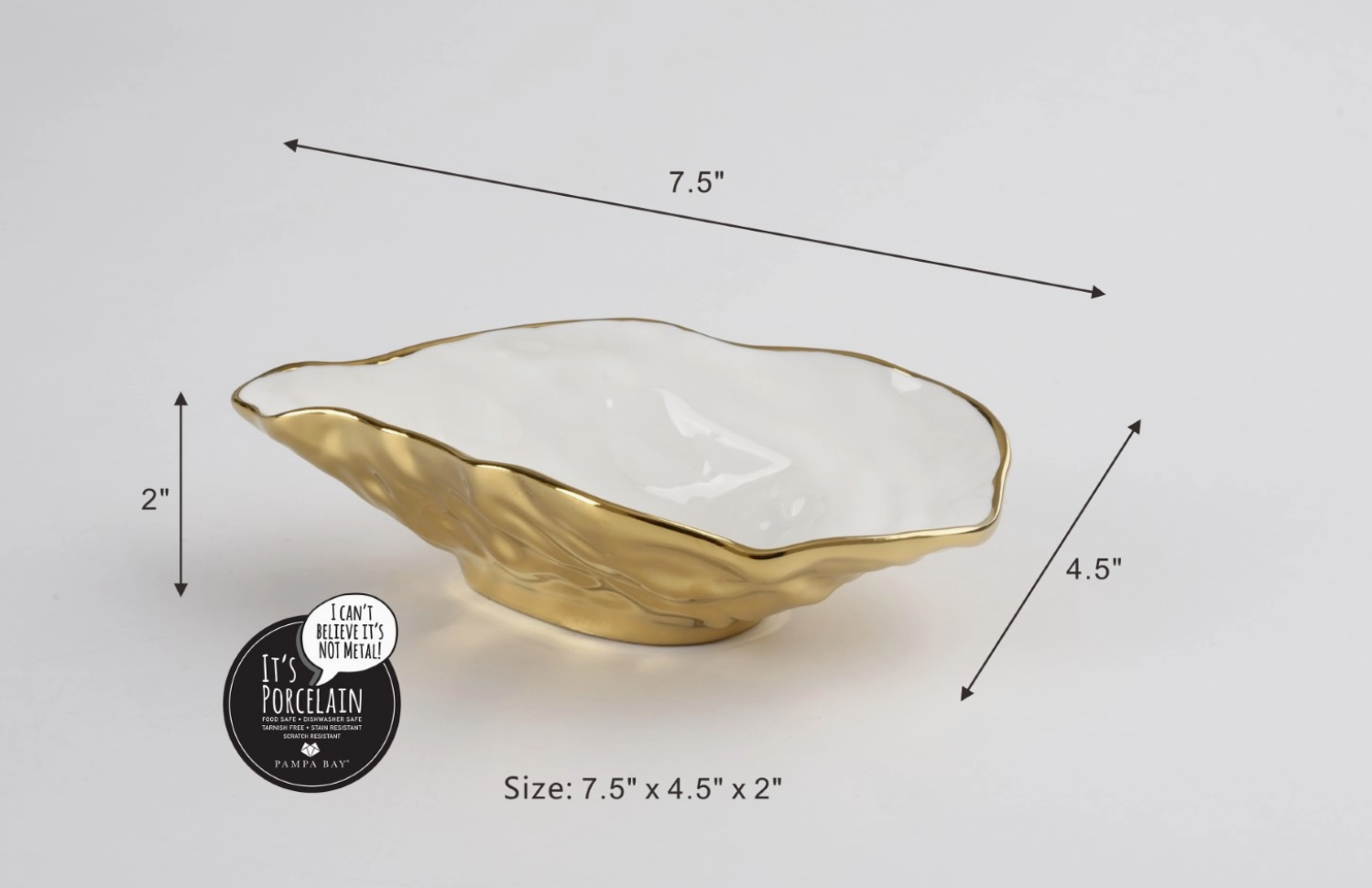 Porcelain by Pampa Bay organic leaf-shaped decorative bowl with a gleaming gold exterior and pristine white interior measuring 7.5 by 4.5 by 2 inches