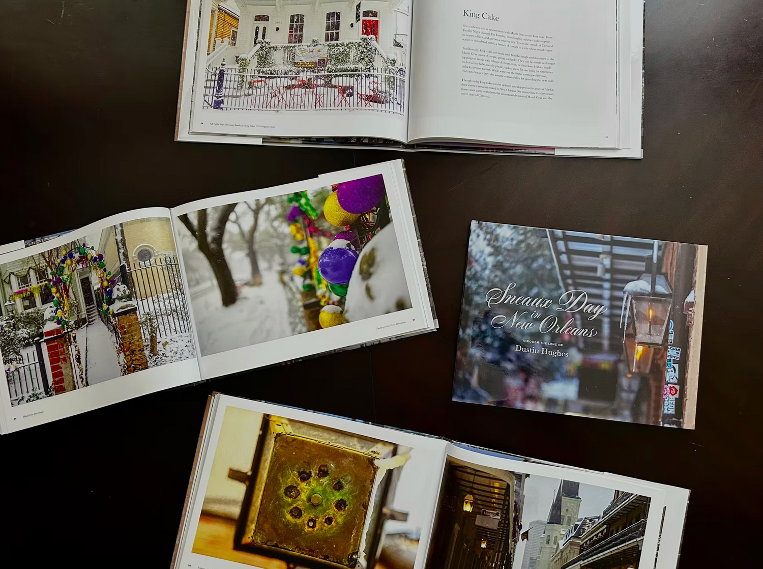 Dustin Hughes photography books depict a rare Sneaux Day in New Orleans, featuring snow-dusted historic architecture including St Louis Cathedral, vibrant purple gold and green Mardi Gras beads, and details on King Cake