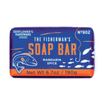 Gentlemen's Hardware bar of soap "The Fisherman's Soap Bar" on a white background, featuring a dark blue and orange package design with a stylized fish, a fishing hook, and "Mandarin Spice" text