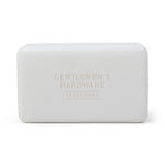Product photography of a white bar of Gentlemen's Hardware soap with embossed Trademark text on a white background
