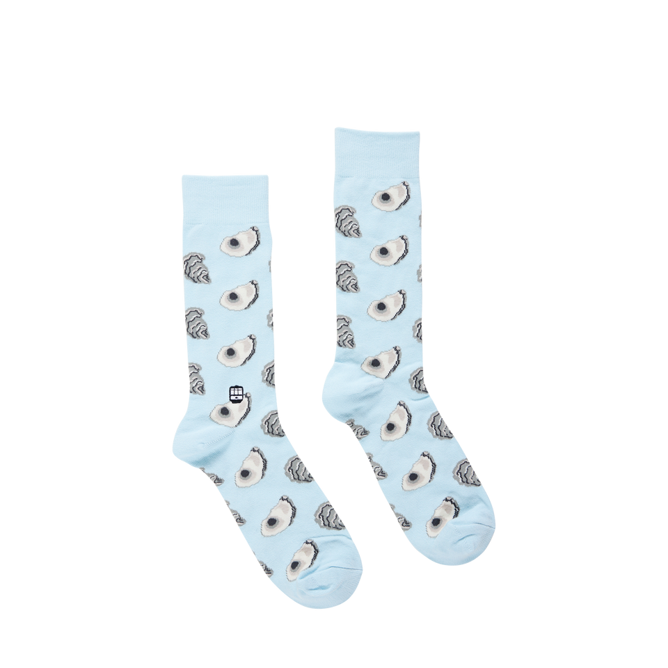 Light blue crew socks with an oyster pattern and a small cable car icon