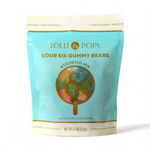 Product photography of a translucent teal Lolli & Pops Sour Six Gummy Bears Assorted Mix bag, prominently displaying a gold lollipop-style ampersand logo against colorful artificial fruit-flavored candies and specifying Net Wt 6 OZ