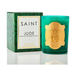 Saint Jude Rose and Sandalwood candle in a vibrant green glass jar with a gold relief label featuring Saint Jude, alongside its matching dark green box with a subtle rose pattern