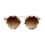 A pair of stylish sunglasses isolated on a white background with speckled cream and brown tortoise shell frames, gradient brown lenses, and a gold metal double bridge