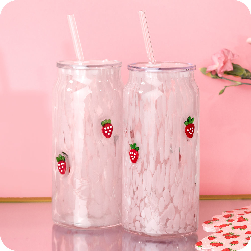 Two glass can cups with white speckled pattern and strawberry decals with lids and glass straws