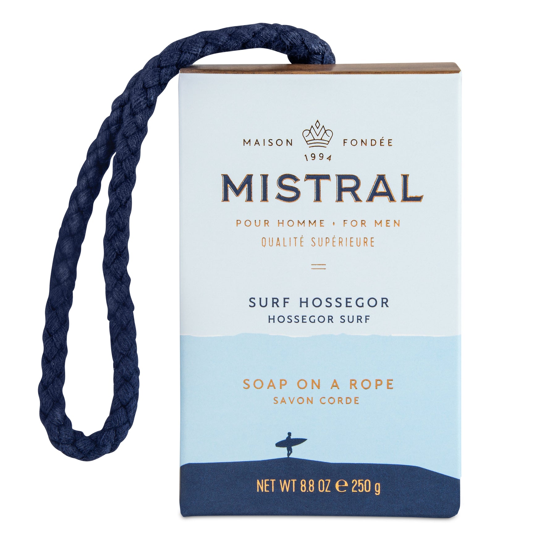 Mistral product packaging for Surf Hossegor men's soap on a rope a white and light blue box with a dark blue braided rope a surfer silhouette and gold Mistral branding