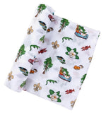 White muslin baby swaddle with Louisiana themed icons including alligators, crawfish, magnolias, and fleur de lis