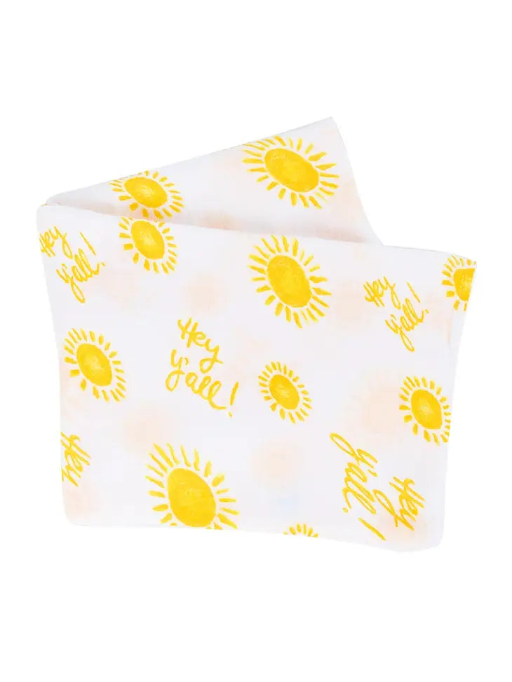 White fabric with yellow sun illustrations and the text Hey yall