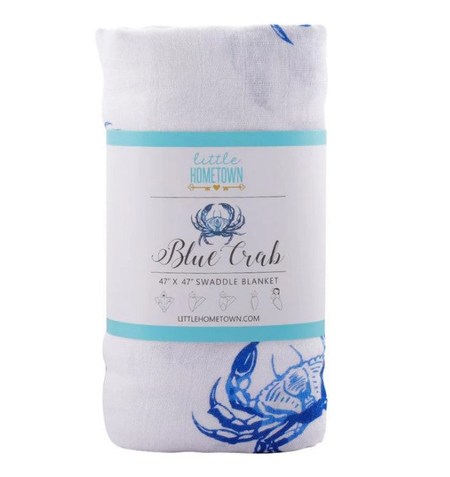 White swaddle blanket with blue crab pattern and Little Hometown brand packaging